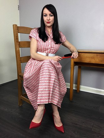 Miss Jessica in 1950's Dress with wooden hairbrush
